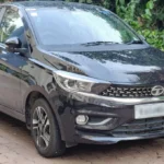 Tata Tiago: बजट में उपलब्ध स्टाइलिश हचबैक, शानदार फीचर्स और भरोसेमंद सुरक्षा